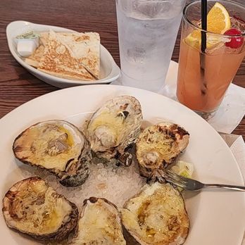Fish City Grill - Chargrilled oysters half, water, hurricane drink, toasted bread with butter - Seafood Near Me - Richardson, Texas Fish City Grill - Chargrilled oysters half, water, hurricane drink, toasted bread with butter - Seafood Near Me - Richardson, Texas