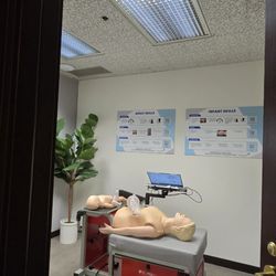 SureFire CPR - SureFire CPR room with door opened and manikins/mannequins + computer inside.