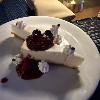 Deep Cut - Cheesecake with berry compote and whipped cream. Rich and creamy! - Steakhouses Near Me - Mettler, California