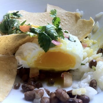 The Revelry - The beauty of a perfectly poached egg. Huevos Rancheros - New American Near Me - Rochester, New York The Revelry - The beauty of a perfectly poached egg. Huevos Rancheros - New American Near Me - Rochester, New York