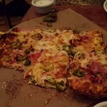 BJ's Restaurant & Brewhouse - Spicy pig tavern cut pizza w/jalapenos - Pizza Near Me - Brea, California