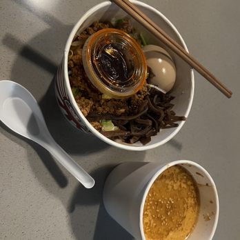 Menya Daruma - Tan tan ramen as ordered to go. I added mushrooms. - Noodles Near Me - Charlotte, North Carolina Menya Daruma - Tan tan ramen as ordered to go. I added mushrooms. - Noodles Near Me - Charlotte, North Carolina