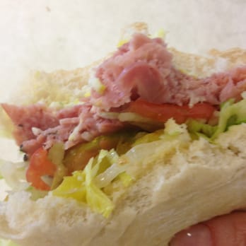 Intermission Deli - a person holding a sandwich - Delis Near Me - Saginaw, Michigan Intermission Deli - a person holding a sandwich - Delis Near Me - Saginaw, Michigan