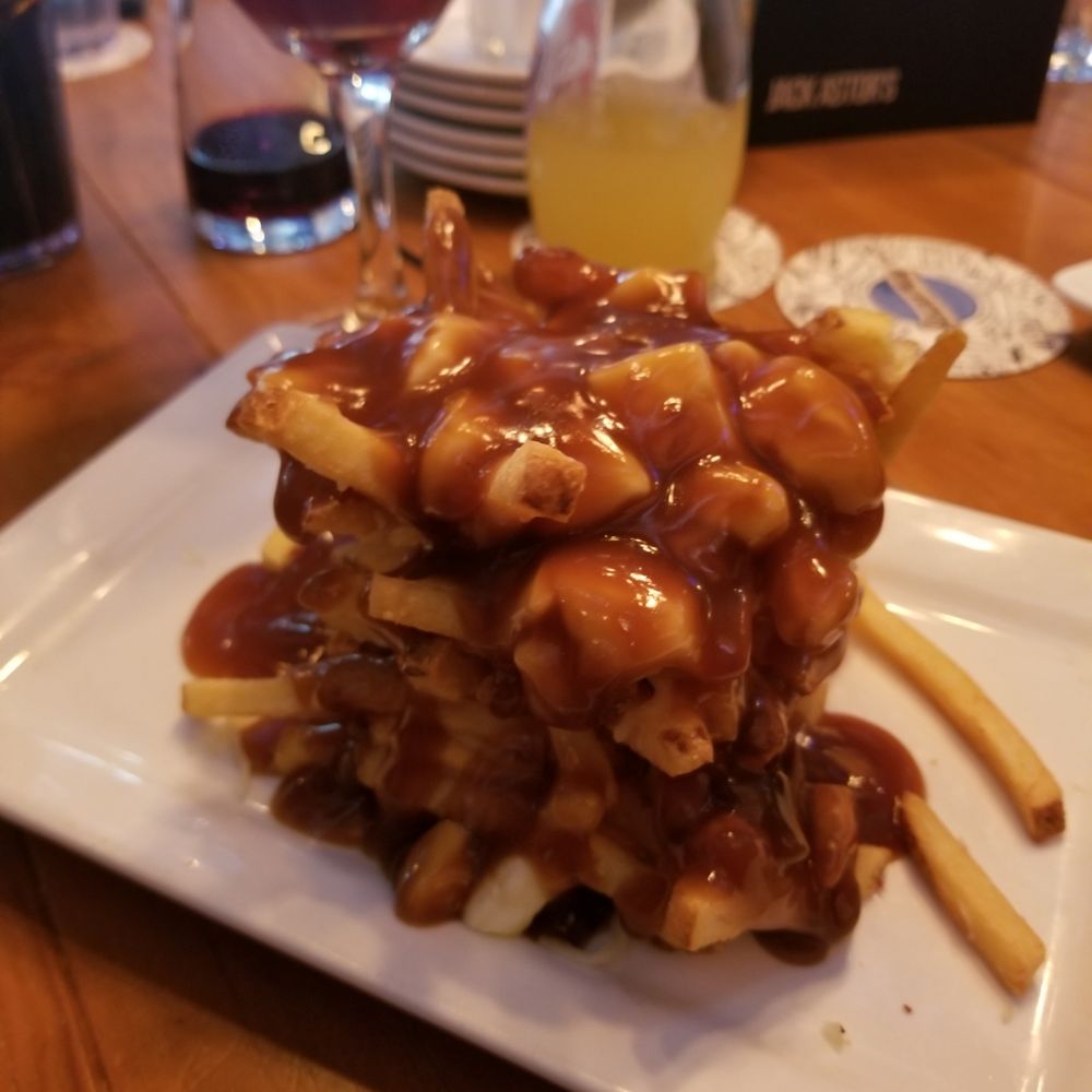 Jack Astor's - classic stack, didn't have much going on in the middle of it, all the cheese and sauce were not enough for the fries - Sports Bars Near Me - St. John's, Newfoundland and Labrador
