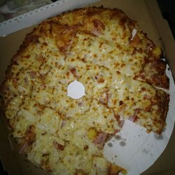 Pizza King - A $32 Hawaiian pizza with a few pineapple.