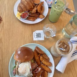 Bacon, Egg & Cheese Croissant w/ Wedges B.L.A.T.E. w/ Wedges Iced Latte Iced Matcha Latte Bacon, Egg & Cheese Croissant w/ Wedges B.L.A.T.E. w/ Wedges Iced Latte Iced Matcha Latte