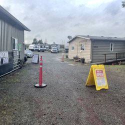 Blair's I-5 RVS - Parking out front, check-in window to the right. Inventory is posted on gate, prices in the info box.