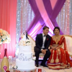 Your Events Decor - Wedding cake, flowers and backdrop drapes setting for another beautiful Nepal wedding in Irving.
