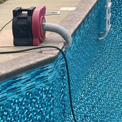 Platinum Pool Service - Pulling vacuum to remove wrinkles.