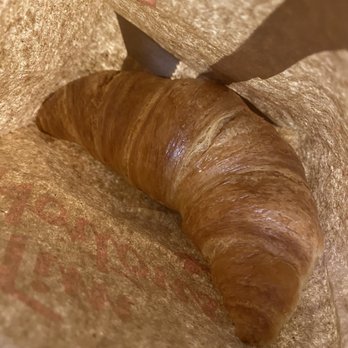 Tim Hortons - a croissant being cut by a knife - Coffee & Tea Near Me - North Vancouver, British Columbia Tim Hortons - a croissant being cut by a knife - Coffee & Tea Near Me - North Vancouver, British Columbia