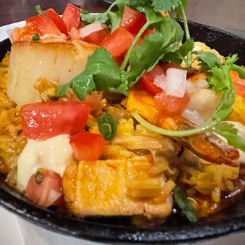 MW Restaurant - Seafood paella (Kona lobster, Kauai shrimp, Bristol Bay scallop, crab, clams, andouille sausage and saffron rice) - New American Near Me - Honolulu, Hawaii MW Restaurant - Seafood paella (Kona lobster, Kauai shrimp, Bristol Bay scallop, crab, clams, andouille sausage and saffron rice) - New American Near Me - Honolulu, Hawaii