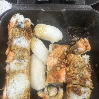 Drake's - 2 sushi rolls and a calamari nigiri. Horrible sushi presentation. My teenage child could do better than this. - American Near Me - Knoxville, Tennessee