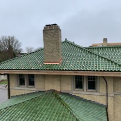 Tile Roofs - shiny green Spanish clay tile installed
