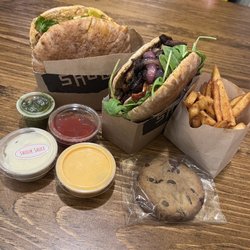 Shouk - Cardamom cookie and spiced fries. Sauces are harissa Mayo (orange), shouk sauce (white)