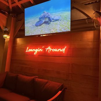 The Lounge - a large television mounted above a couch - Lounges Near Me - Glendale, California The Lounge - a large television mounted above a couch - Lounges Near Me - Glendale, California