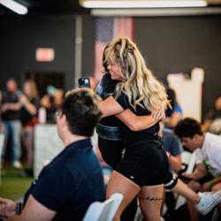 MissFit Strength - Celebrating her athlete at a competition