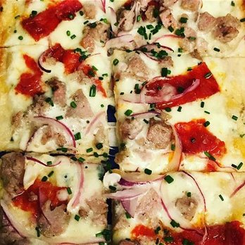 Pizza Arno - a square pizza cut into four pieces - Food Trucks Near Me Pizza Arno - a square pizza cut into four pieces - Food Trucks Near Me