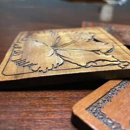 Top pealing off. Is seems they are cork with a paper thin sliver of wood glues on. Top pealing off. Is seems they are cork with a paper thin sliver of wood glues on.