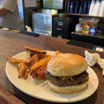 Canipe Brothers Bar & Grill - The Big Burger with tater wedges. A good size burger. - American Near Me - Charlottesville, Virginia Canipe Brothers Bar & Grill - The Big Burger with tater wedges. A good size burger. - American Near Me - Charlottesville, Virginia