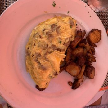 Oliver's Bistro - regular omelet with sausage and egg! Notice the sausage isn't crumbled - wish we would have known before hand - Breakfast & Brunch Near Me - Miami Beach, Florida Oliver's Bistro - regular omelet with sausage and egg! Notice the sausage isn't crumbled - wish we would have known before hand - Breakfast & Brunch Near Me - Miami Beach, Florida
