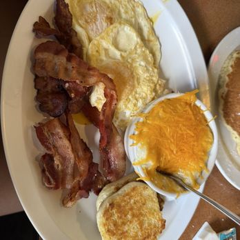 Christo's Cafe - Two eggs classics Came with bacon, grits and a biscuit - Breakfast & Brunch Near Me - Orlando, Florida