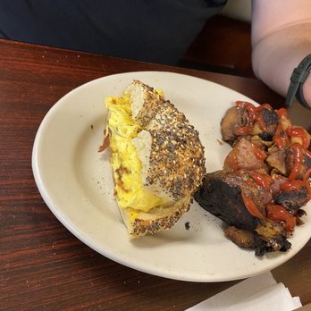 Rob's Bageland - Bacon egg and cheese 'mess' sandwich on Everything bagel with slightly over cooked home fries - Delis Near Me - Plantation, Florida Rob's Bageland - Bacon egg and cheese 'mess' sandwich on Everything bagel with slightly over cooked home fries - Delis Near Me - Plantation, Florida