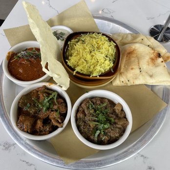 Curry Up Now - Meat sweats platter featuring from L to R butter chicken, kashmiri lamb and kadhai chicken. - Indian Near Me - Alpharetta, Georgia