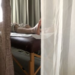 Structure Acupuncture - A patient during a Community Acupuncture