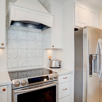 Luxurious Stone - The cuts were made in between the stove and they hid it very well in the back of the stove! - Countertop Installation Near Me - Hayward, California
