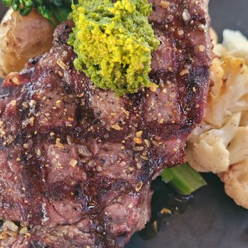 Bridgewater Bistro - New York Steak.  Seasoned very well.  Cold potatoes, and cauliflower. - New American Near Me - Astoria, Oregon
