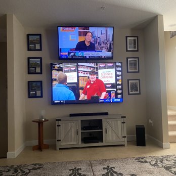 Frank's Installations - 55" stacked on top of a 75" all wires tucked nfl sound bar connected with 2 cable boxes and a PS4 looks super clean - TV Mounting Near Me Frank's Installations - 55" stacked on top of a 75" all wires tucked nfl sound bar connected with 2 cable boxes and a PS4 looks super clean - TV Mounting Near Me