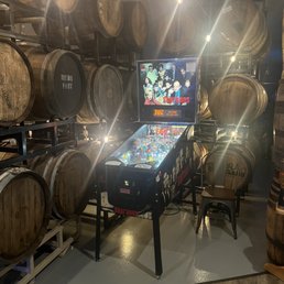 Pin ball machine and wine barrels Pin ball machine and wine barrels