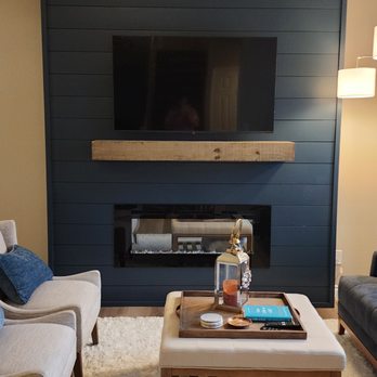 JT Interiors - a living room with couches and a fireplace - General Contractors Near Me - Vancouver, Washington