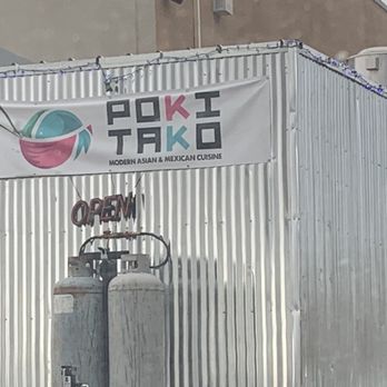 Poki Tako - a sign on a building - Food Trucks Near Me - Santa Fe, New Mexico
