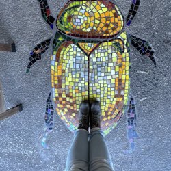 Poe's Tavern - Gold bug art outside