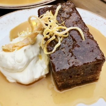 Red Rabbit Minneapolis - STICKY TOFFEE CAKE - salted caramel sauce, whipped sour cream, candied orange zest - Italian Near Me - Minneapolis, Minnesota Red Rabbit Minneapolis - STICKY TOFFEE CAKE - salted caramel sauce, whipped sour cream, candied orange zest - Italian Near Me - Minneapolis, Minnesota