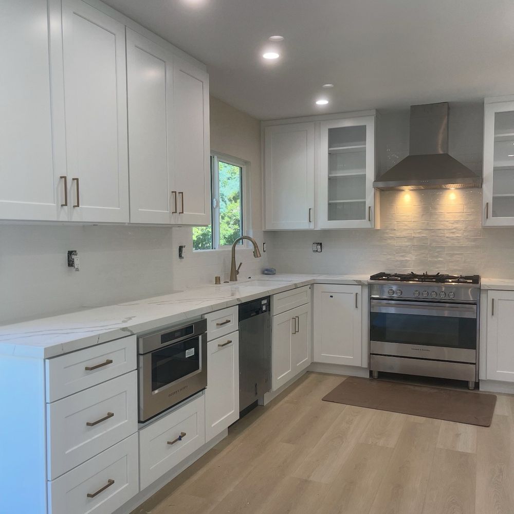 Green Renovation Group - Actual kitchen. Turned out beautifully with champagne gold hinges, quartz countertop, cabinets, window wall up and redesign. - General Contractors Near Me - Sherman Oaks, California