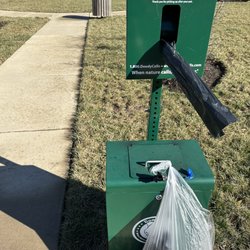 Metropolis - Dog waste station at the small pocket park for sitting and chatting