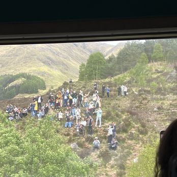 Jacobite Steam Train - People waiting for the train to pass. - Travel Services Near Me