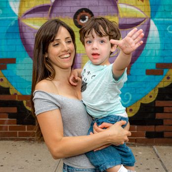 Remi Malca Photography - Bright smiles and bold colors - this Brooklyn mural moment captures the playful bond between mother and son. - Event Photography Near Me - Brooklyn, New York Remi Malca Photography - Bright smiles and bold colors - this Brooklyn mural moment captures the playful bond between mother and son. - Event Photography Near Me - Brooklyn, New York