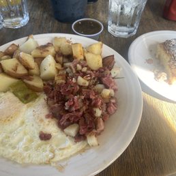 Corned beef with diced potatoes and more potatoes, eggs cooked perfectly and coffee cake Corned beef with diced potatoes and more potatoes, eggs cooked perfectly and coffee cake