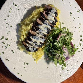 Brevardian Riverfront - Jerked duck breast over curry rice and Arugula salad - Seafood Near Me - Melbourne, Florida