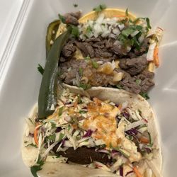 Memo's Cocina & Tequila Bar - Left over carne asada taco and avocado taco