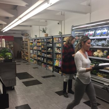 Sunshine Wholesome Market - a woman walking through the store - Health Markets Near Me - Toronto, Ontario Sunshine Wholesome Market - a woman walking through the store - Health Markets Near Me - Toronto, Ontario