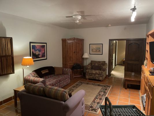 Guest Rooms - Our Arizona bed and breakfast’s modern territorial hacienda is designed to evoke the traditional architecture of Spain and Mexico. Mexican hardwood furnishings with hand carved embellishments add an elegant touch to the setting. We have 10 comfortable guest rooms, each with a private bathroom with shower. Each room features elegant linens in tasteful and relaxing colors that match our southwest setting and themes. A table and chairs are just outside your window on the courtyard walkway. Our Arizona bed and breakfast also features the art from local artists hanging in each room. We also have one King Suite that features a full kitchen, dining area, living room with fold out couches, and a separate master bed room with a King Bed, plus an en suite bathroom with shower. Guest Rooms - Our Arizona bed and breakfast’s modern territorial hacienda is designed to evoke the traditional architecture of Spain and Mexico. Mexican hardwood furnishings with hand carved embellishments add an elegant touch to the setting. We have 10 comfortable guest rooms, each with a private bathroom with shower. Each room features elegant linens in tasteful and relaxing colors that match our southwest setting and themes. A table and chairs are just outside your window on the courtyard walkway. Our Arizona bed and breakfast also features the art from local artists hanging in each room. We also have one King Suite that features a full kitchen, dining area, living room with fold out couches, and a separate master bed room with a King Bed, plus an en suite bathroom with shower.