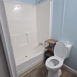 ClearPath Contractors - Remodeled Bathroom with new Tub and Shower combo, with new Toilet, and New flooring install.
