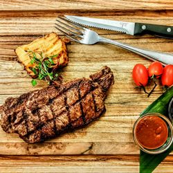 The Choice - New York Steak: Prime 10 OZ Served with potato au gratin, spicy Peruvian and teriyaki sauces on the side. $40