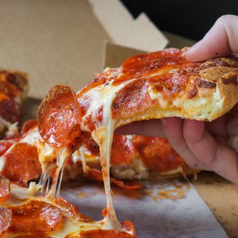 Westside Pizza - a hand holding a slice of pepperoni pizza - Pizza Near Me - West Haven, Utah Westside Pizza - a hand holding a slice of pepperoni pizza - Pizza Near Me - West Haven, Utah