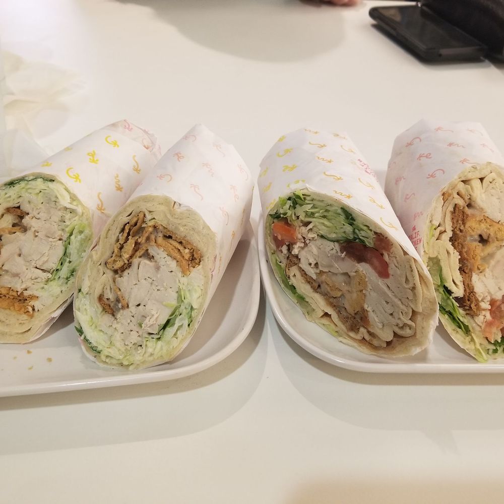 Calif Chicken Cafe - 2 Chicken Caesar Wraps, no tomato on left. Both super dry. - American Near Me - Northridge, California