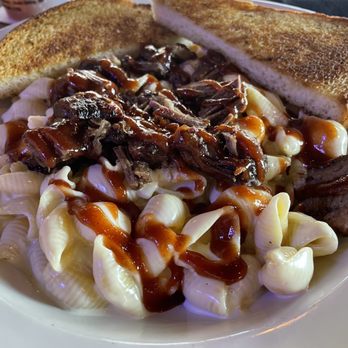 Captain's Sports Lounge - Adult mac and cheese, topped with burnt ends and a thick sweet sauce. - Sports Bars Near Me - Grain Valley, Missouri Captain's Sports Lounge - Adult mac and cheese, topped with burnt ends and a thick sweet sauce. - Sports Bars Near Me - Grain Valley, Missouri